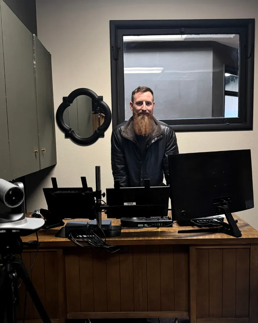 Josh Atkinson at the control desk in AV-Ator Studios.